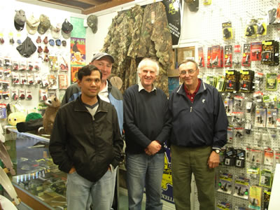 US shooter Leo (L) and BCY's Chris (L) and Bob Deston flank Abbey Archery's Tony Dalton during a visit to Abbey's Sydney pro shop and warehouse