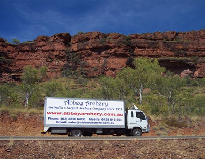Truck passes colourful rock formation at Katherine, Northern Territory